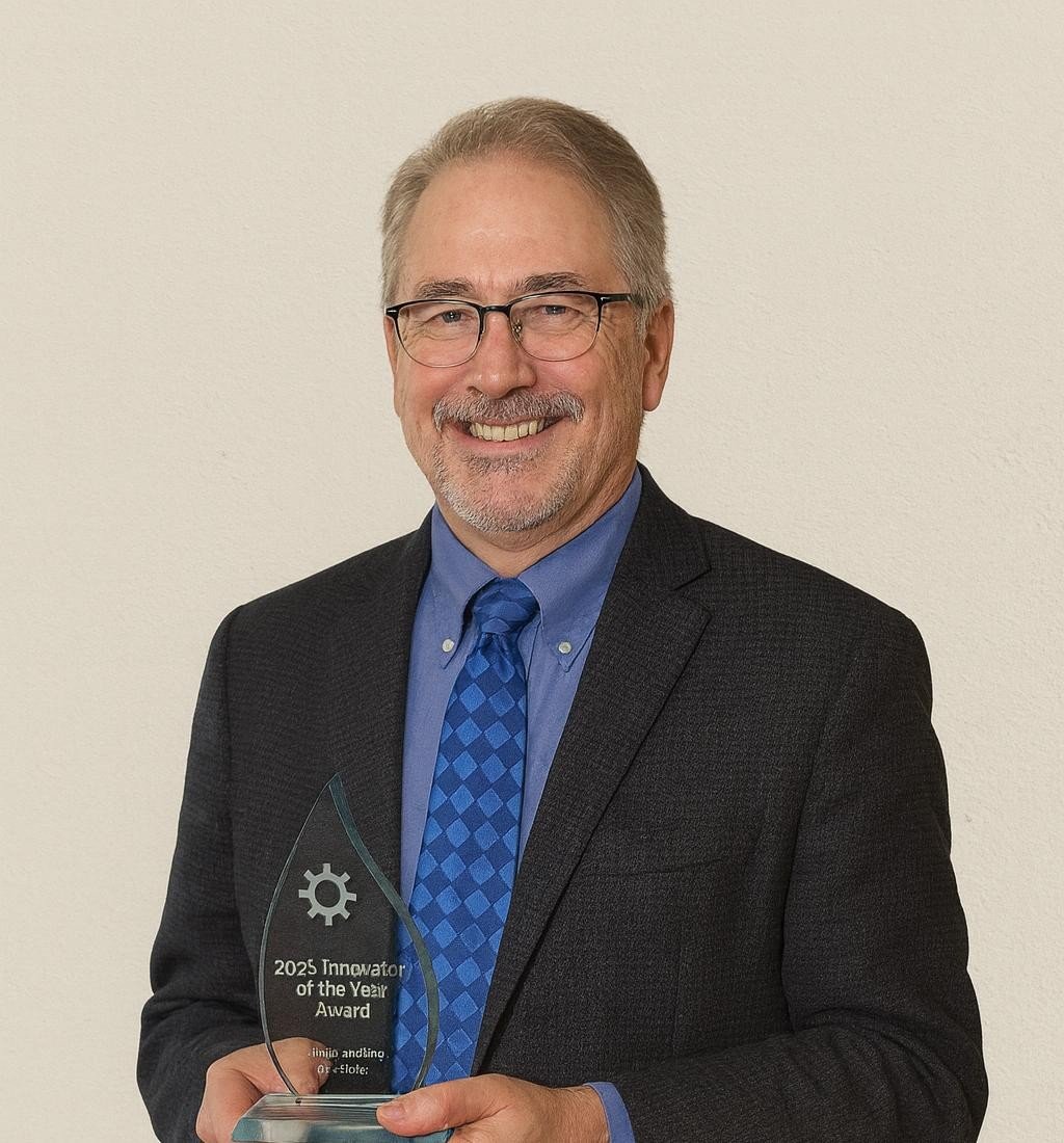 David Gordon, Green Building Partners, holding the 2025 Innovator of the Year Award